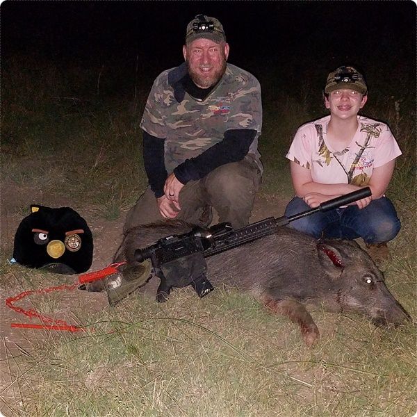 Trophy shot of us with daughter's suppressed hog.
